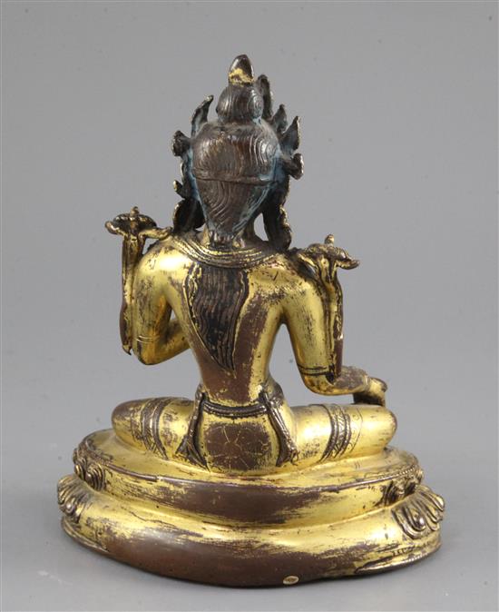 A Tibetan gilt copper alloy figure of Green Tara, 14th-15th century, height 21.3cm